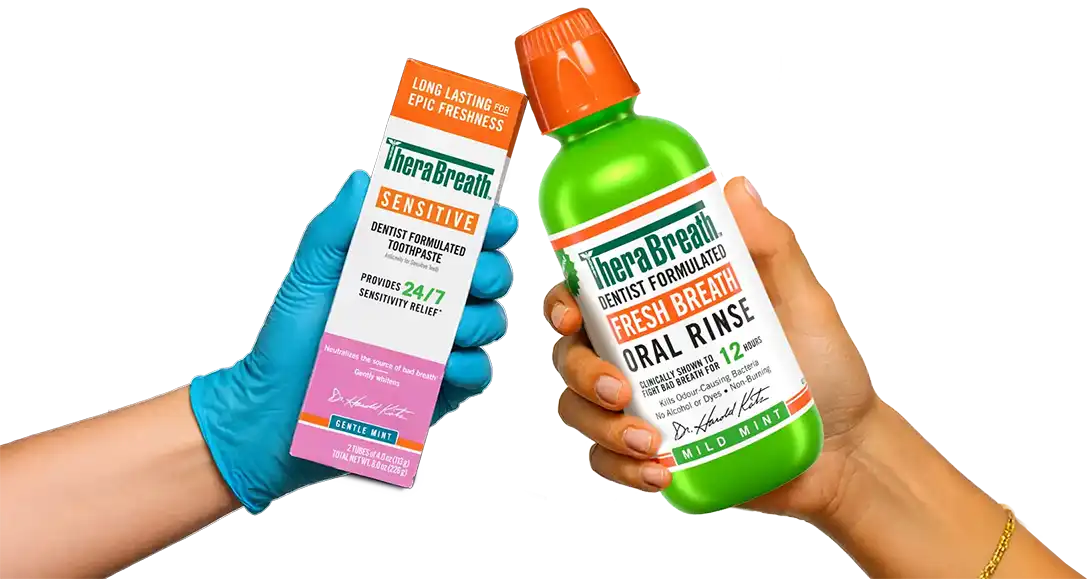 TheraBreath&trade; Sensitive toothpaste and Fresh Breath oral rinse held side by side