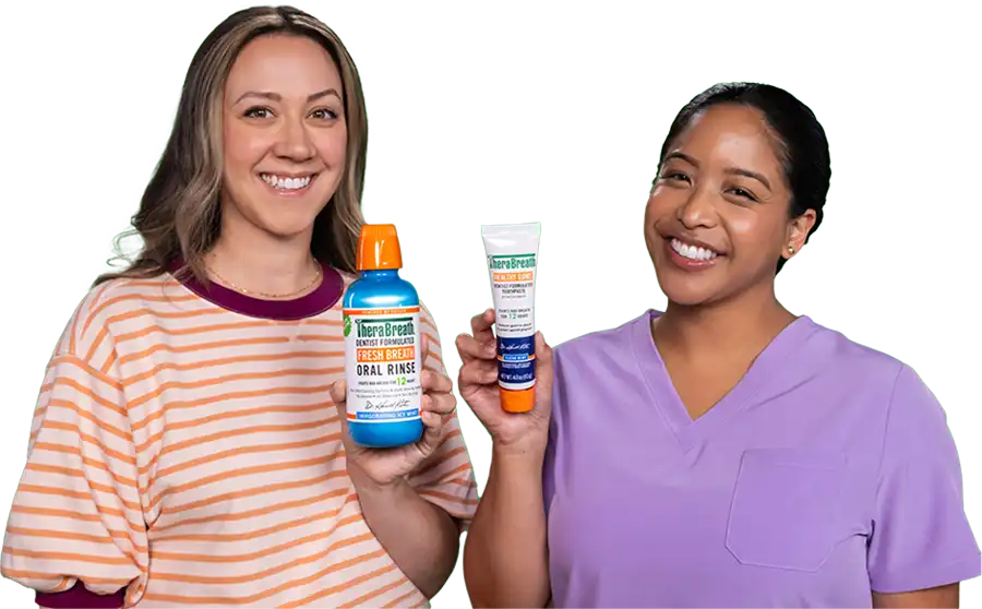 Two Dental Hygenists holding Therabreath toothpaste
