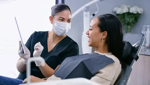 Dental professional with patient